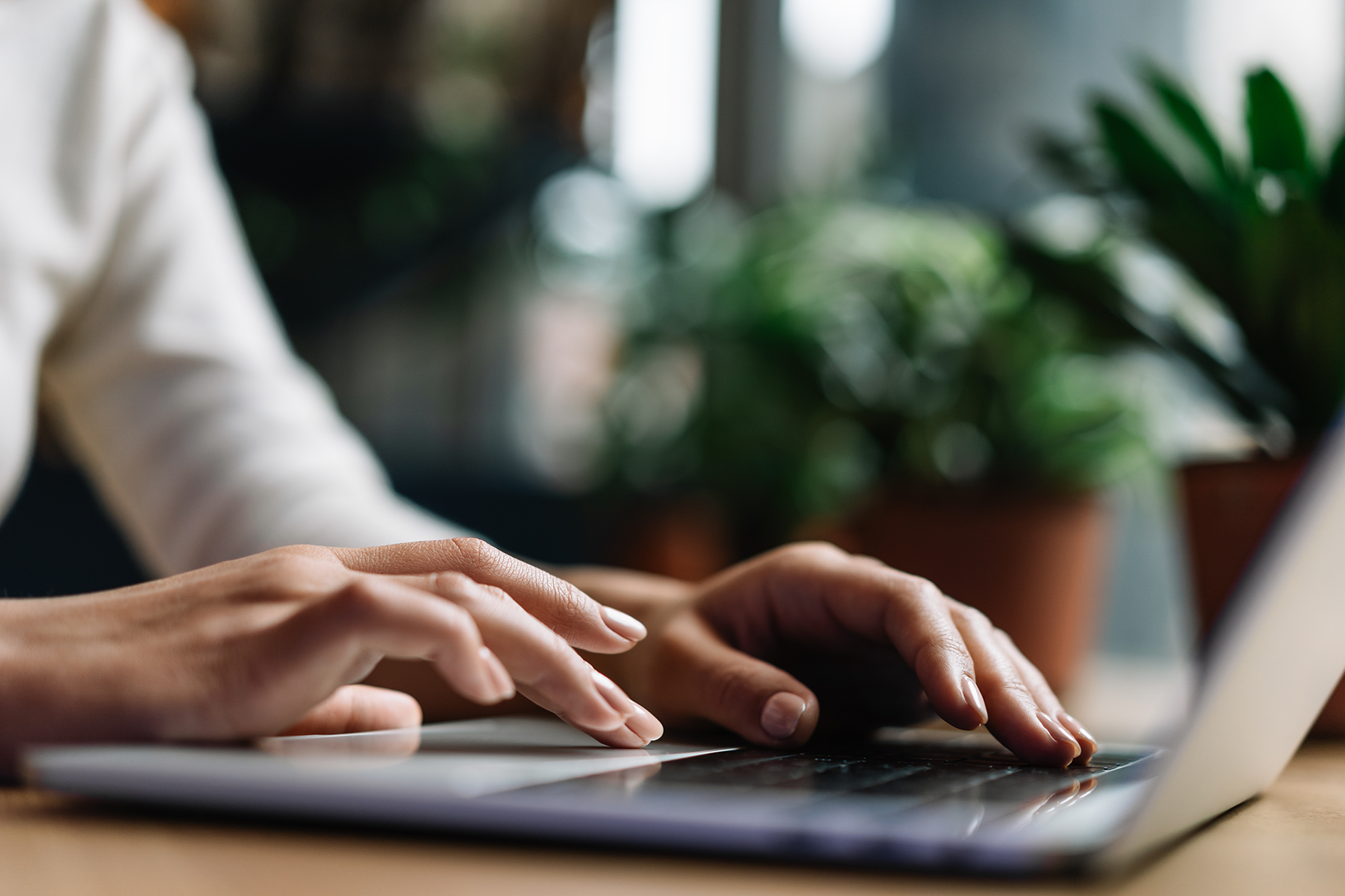 Close-up of a business owner using Thread Banking on their laptop